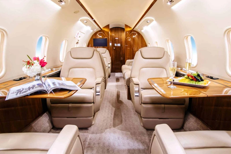Private jet interior with champagne service
